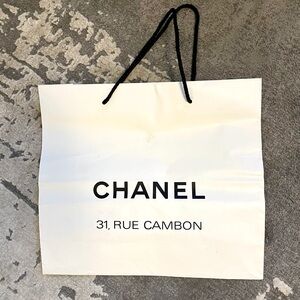 Chanel paper shopping bag. Designer. Genuine.
14”w 12.5”h. From the Paris store.